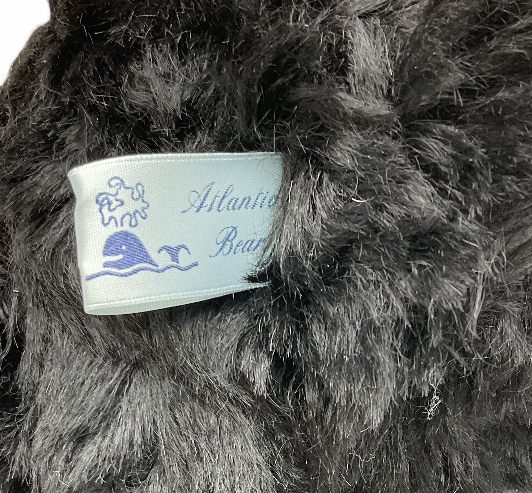 1991 Atlantic Bears limited edition black teddy bear, the revolving head with applied eyes, vertically stitched nose and jointed limbs with growler mechanism No.84/100 H53cm; together with clockwork tin-plate road roller possibly by Mettoy and a push-along painted scratch built wooden locomotive (3)