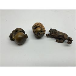 Three netsuke, modelled as two mythical creatures and a lion