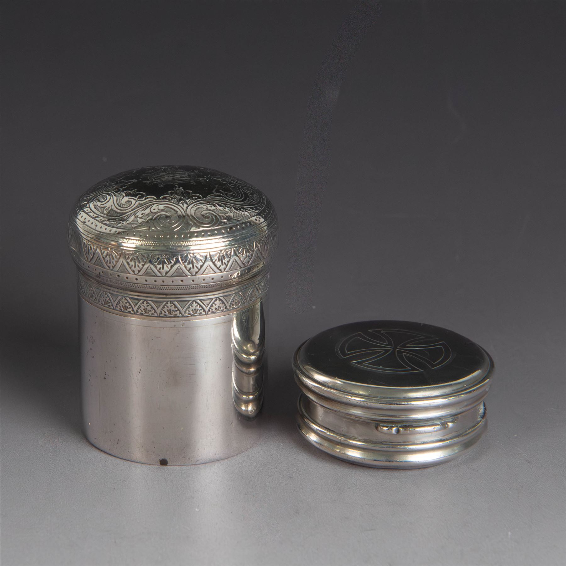 Late Victorian silver jar with cover, of cylindrical form with  domed cover engraved with initials, hallmarked Charles & George Asprey, together with a small ecclesiastical trinket box, engraved with cross to cover and with personal engraving beneath, hallmarked Edgar Ernest Davis, London 1944, taller jar H6cm