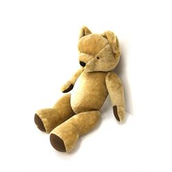 Very large Merrythought teddy bear with swivel jointed head, applied eyes, vertically stitched nose and mouth and jointed limbs with brown felt paw pads H50.5