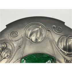 Liberty & Co Tudric pewter Bollelin tray, designed by Archibald Knox, of circular form with shaped edge, cast in relief with foliate tendrils surrounding a green enamel cartouche, impressed beneath Made by Library & Co English Pewter 044, D25.5cm