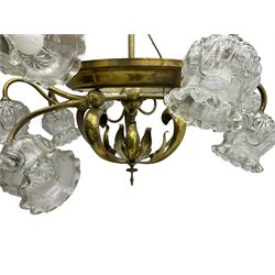 Mid-20th century brass lightolier or light fitting, the scrolling foliate branches connected with a central ring, terminating in ten tulip shaped cut glass sades, pointed terminal beneath