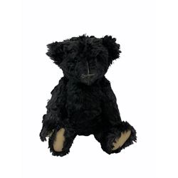 1991 Atlantic Bears limited edition black teddy bear, the revolving head with applied eyes, vertically stitched nose and jointed limbs with growler mechanism No.84/100 H53cm; together with clockwork tin-plate road roller possibly by Mettoy and a push-along painted scratch built wooden locomotive (3)