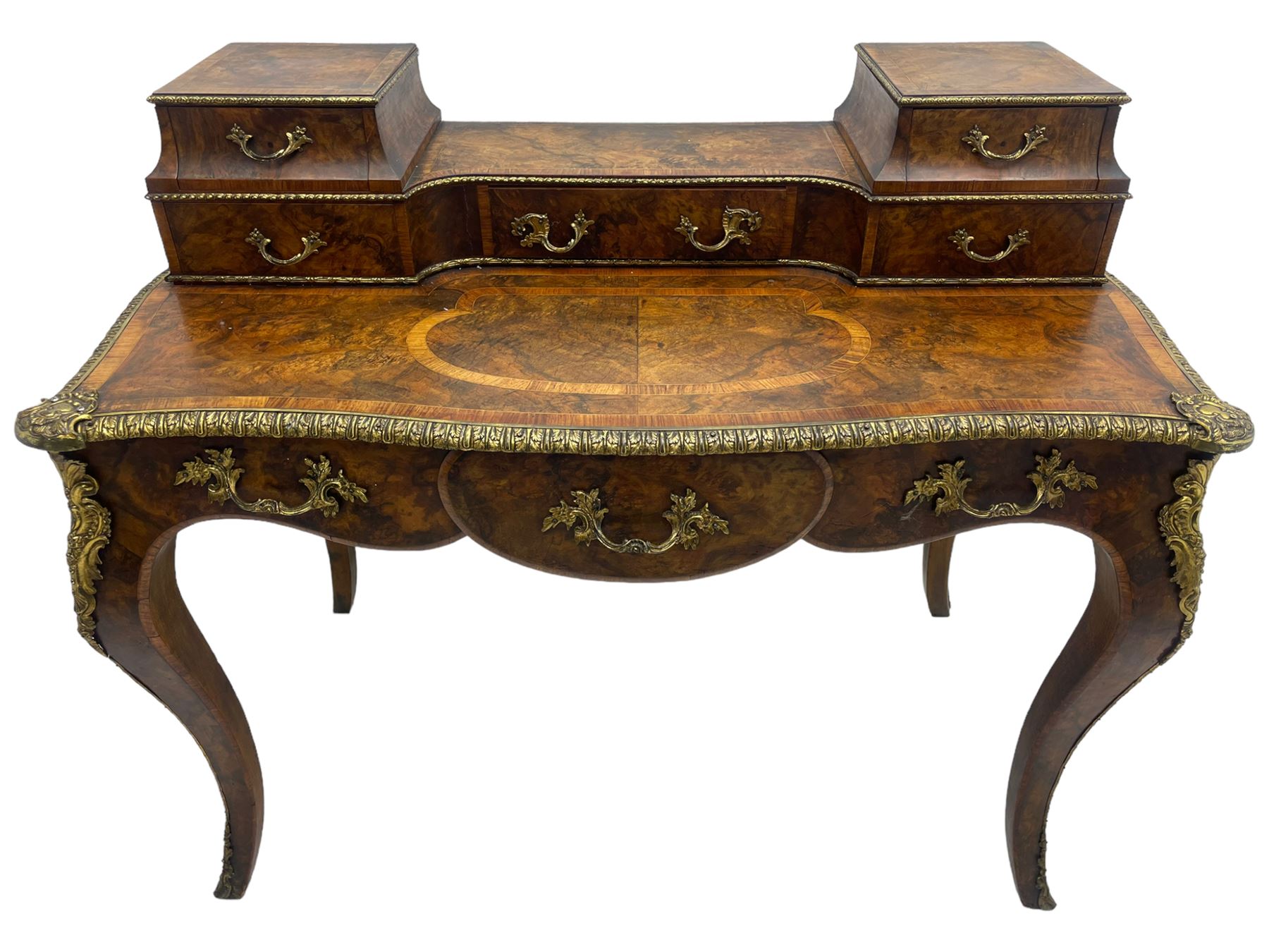 Late 19th to early 20th century French figured walnut writing desk, raised back fitted with drawers, shaped top with Kingwood banding and foliage cast edge moulding, fitted with single drawer, on cabriole supports mounted by shell and flower head cartouches 