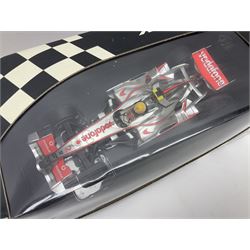 Three Minichamps 1:18 scale die-cast McLaren racing cars - Mercedes MP4-19 D. Coulthard; Mercedes MP4-20 K. Raikkonen; and Vodaphone Mercedes MP4-22 L. Hamilton 2007; all boxed (3)

