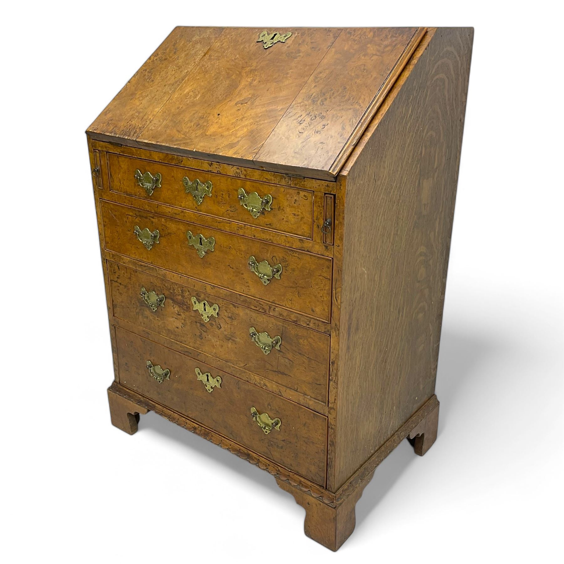 George III figured walnut bureau, fall-front enclosing central cupboard, six pigeonholes and six drawers, fitted with four graduated cockbeaded drawers, on bracket feet