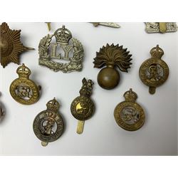 Twenty-six cap badges for Yeomanry and various guards including Fife & Forfar, Lothian and Border Horse, Leicestershire, Northamptonshire, Queens Own, Coldstream, Grenadier, Machine Gun Regiment, Life Guards etc (26)