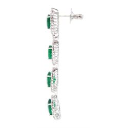 Pair of 18ct white gold graduating emerald and diamond pendant stud earrings, oval cut emerald and round brilliant cut cluster, suspending a single round brilliant cut diamond and three further emerald and diamond clusters, stamped, total emerald weight approx 8.65 carat, total diamond weight approx 3.30 carat