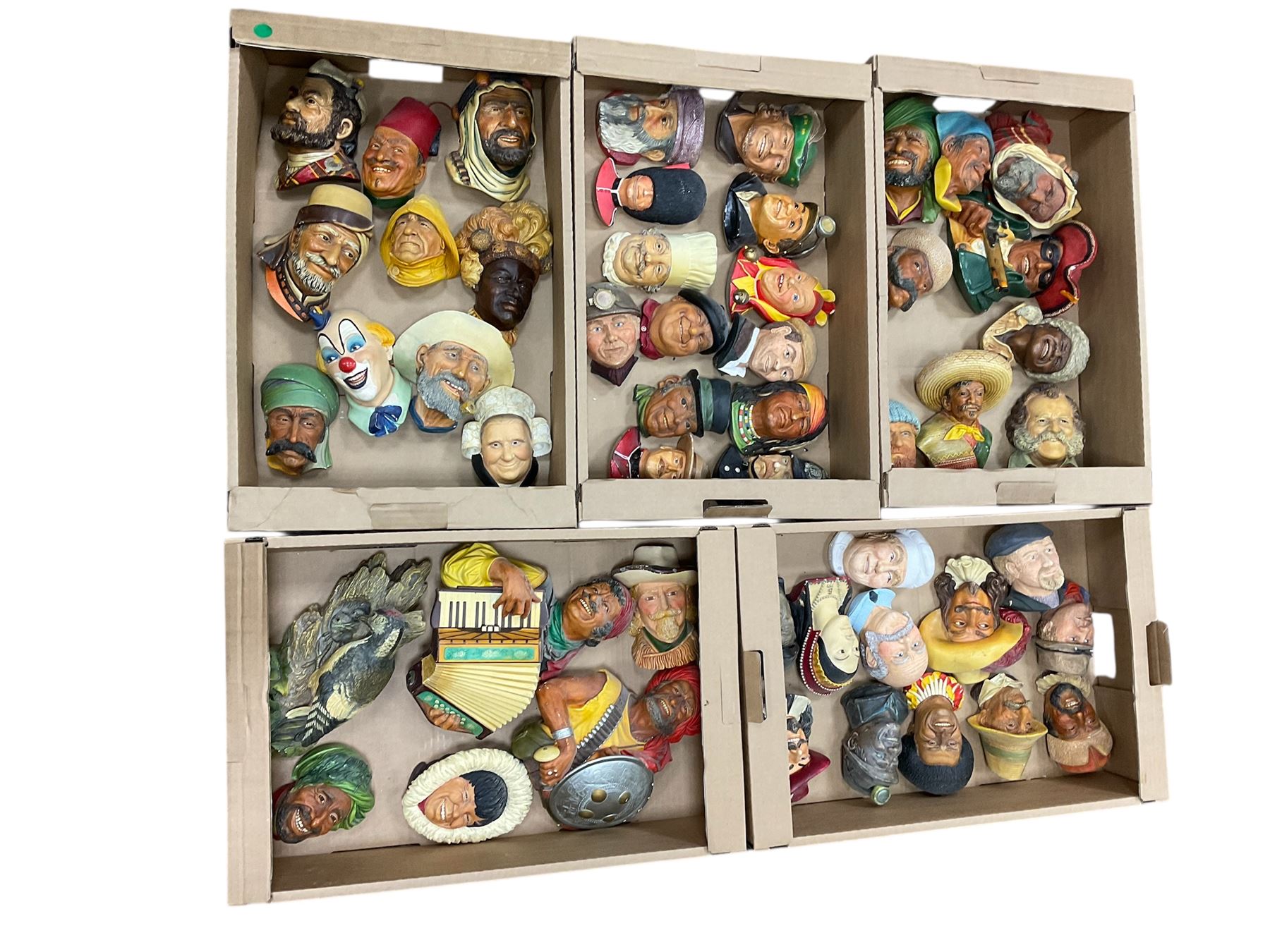 Large collection of Bossons plaster wall-masks, including including fisher man, policeman, highway man, etc, in four boxes 