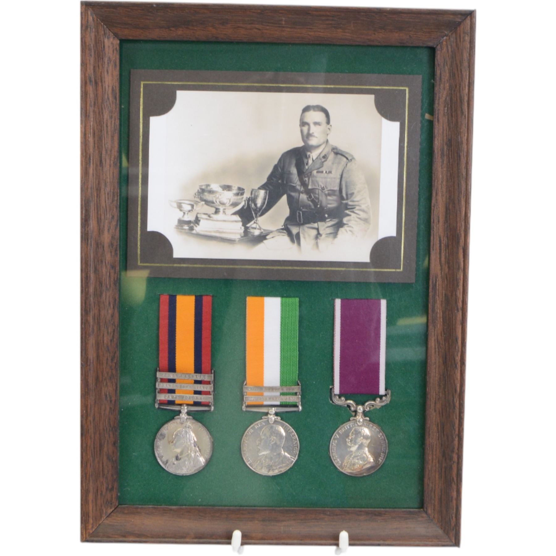 Military medals awarded to two generations of the Lattimore family, Boer War trio; Queen South Africa medal with clasps for Johannesburg, Orange Free State and Cape Colony, Kings South Africa medal with clasps for South Africa 1902 and South Africa 1901 and  Army Meritorious Service Medal, G.V.R, awarded to Frederick John Barcham Lattimore Norfolk Regiment and set of six medals; Burma Star, Defence Medal, War Medal, 1939-45 Star, General Service Cross and National Service Medal, awarded to Captain Albert Edward Lattimore 2nd para Battalion the 3rd Madras Regiment, Indian Army, together with insignias other items relating to Madras Regiment, photographs and ephemera  
