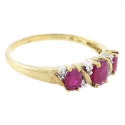 9ct gold ruby and diamond ring, three oval cut rubies spaced by six accent diamonds, stamped 9k