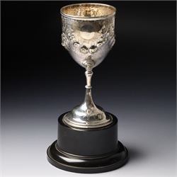 Victorian silver cup with embossed decoration on a plastic base, height of cup 16cm Birmingham 1868 and a small silver challenge cup 'Whitby Show 1950'