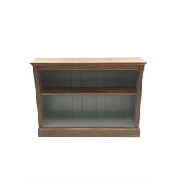 Edwardian oak bookcase, projecting cornice, single shelf, plinth support