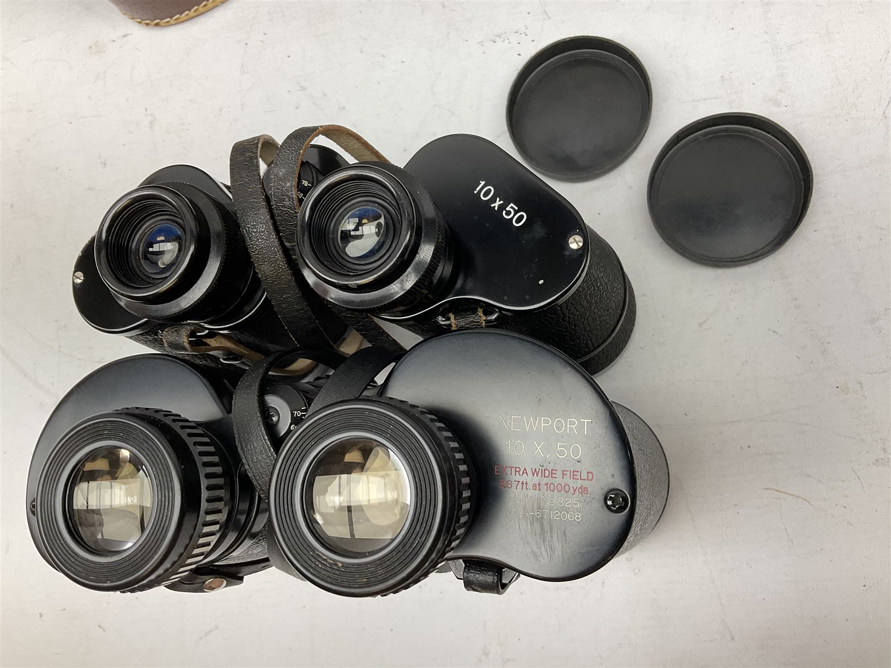 Nine cased pairs of binoculars, to include Tohyoh 22x70, Greenkat 7x- 12x50, Chinon, Fisher-Dietz 7x50, etc