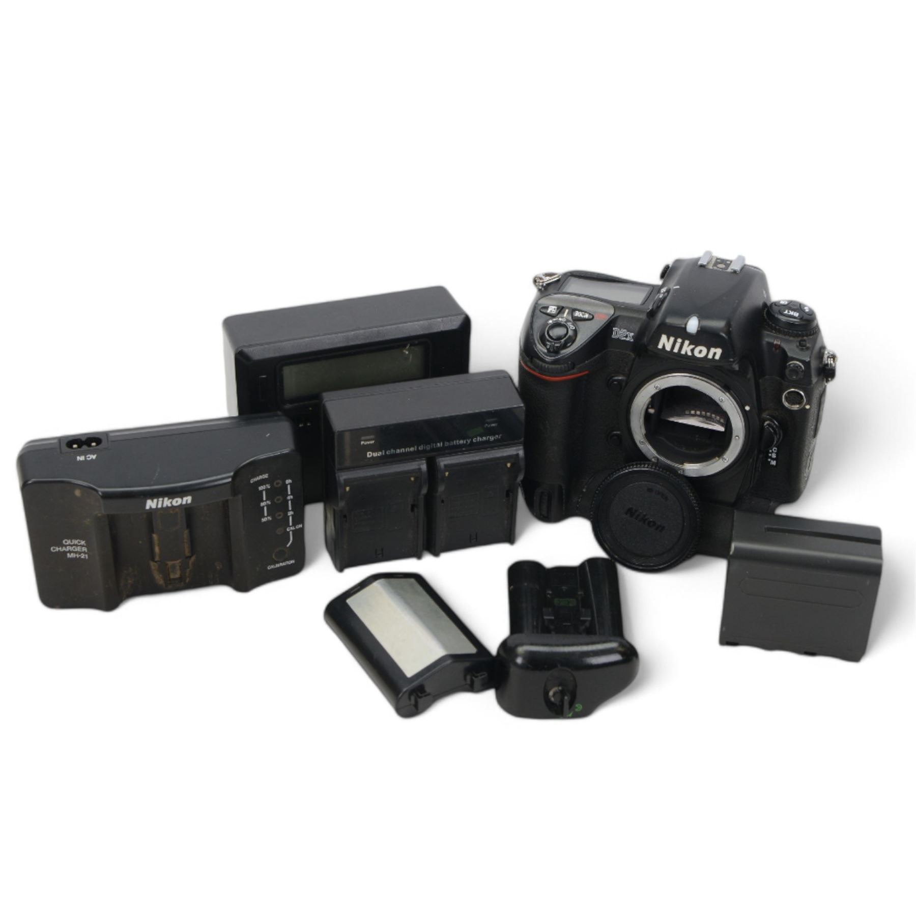 Nikon D2x digital SLR camera body, serial no. 5020627, with some associated battery packs and accessories