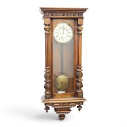 19th century mahogany Vienna Regulator wall clock, carved mahogany framed with turned and half-canted pilasters, over a lobed terminal