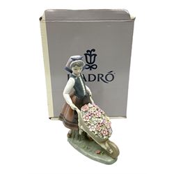 Lladro figure Barrow Of Blossoms, modelled as a girl pushing a wheelbarrow of flowers, no. 1419, with original box, H26cm
