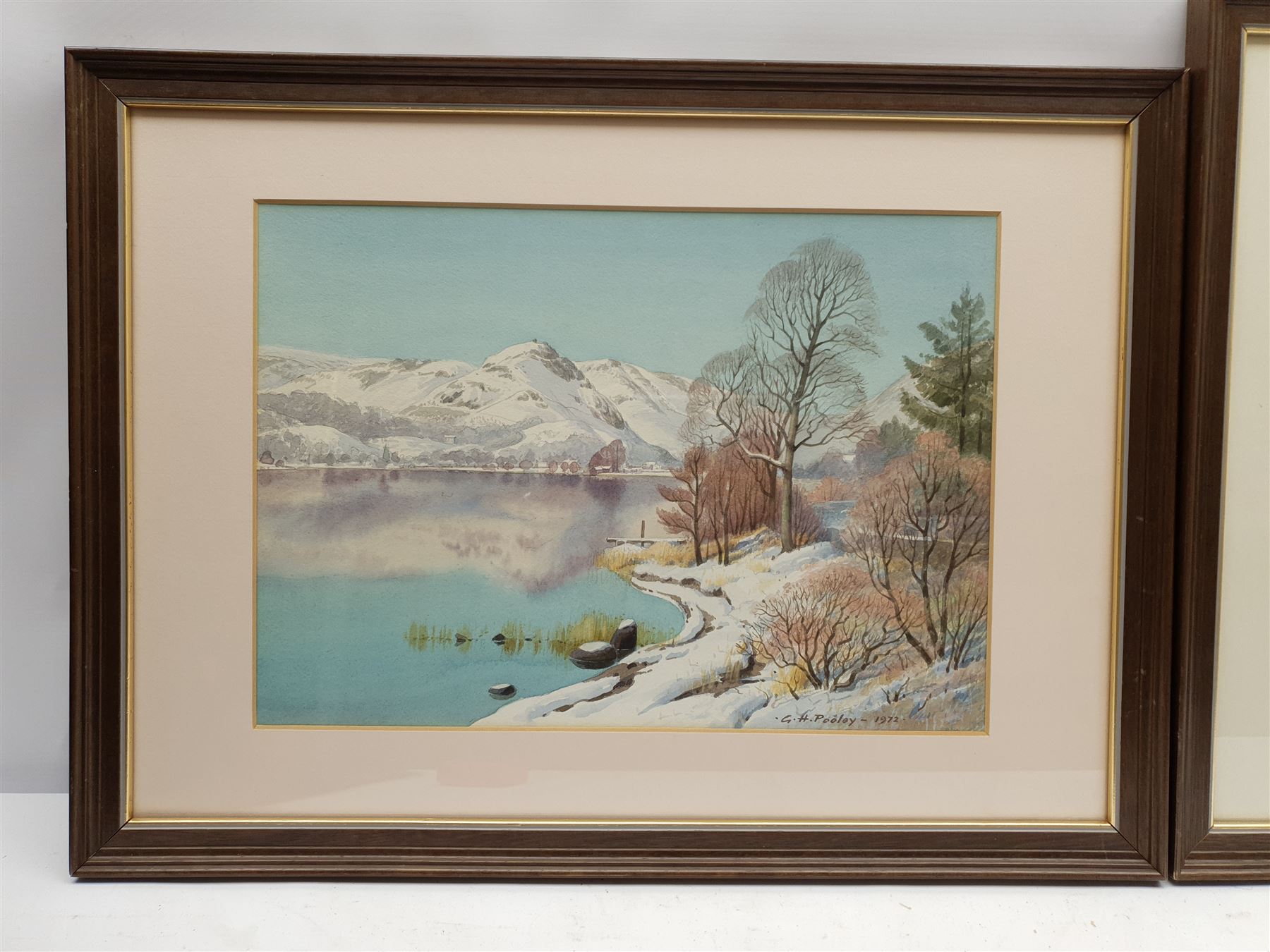 Geoffrey H Pooley (British 1908-2006): Lake District Landscapes in Summer and Winter, pair watercolours signed and dated 1972 (2)