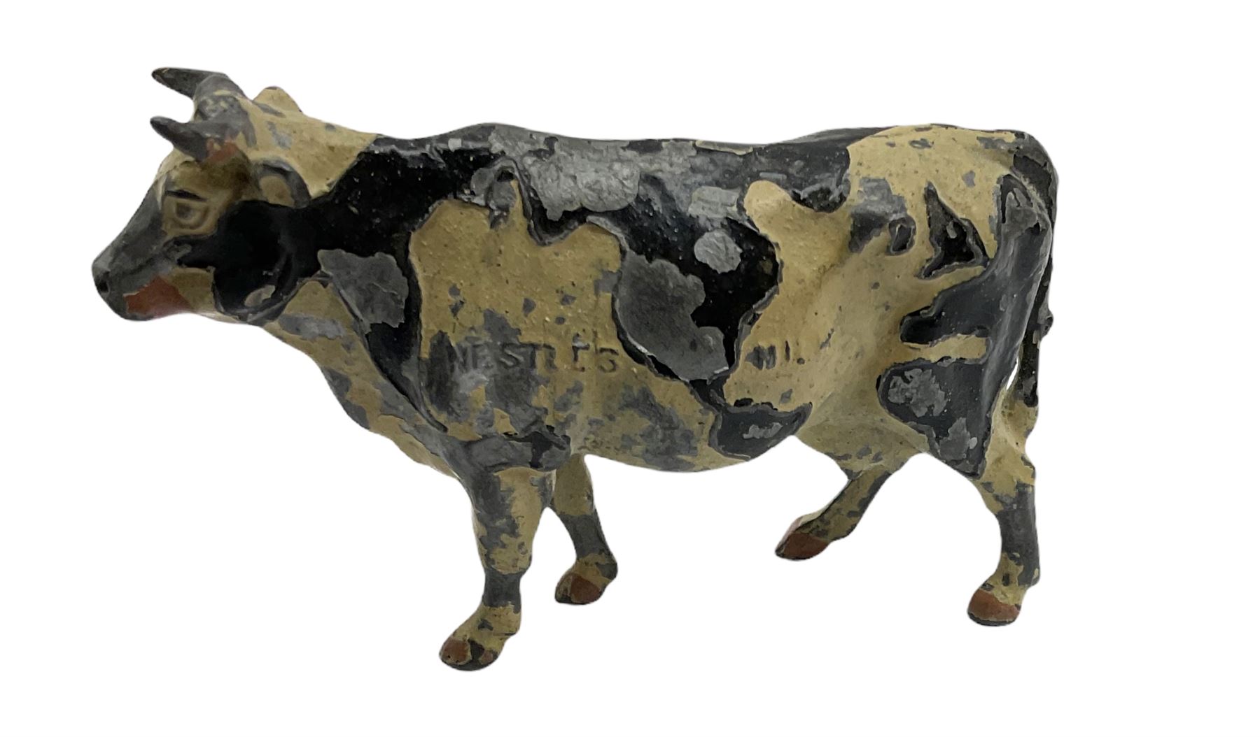 Britains Nestles 'The World's Cow' decorated with map-of-the-world pattern L8cm; and eight other various sized lead figures of cows, standing or reclining, by Britains, Hill & Co etc (9)
