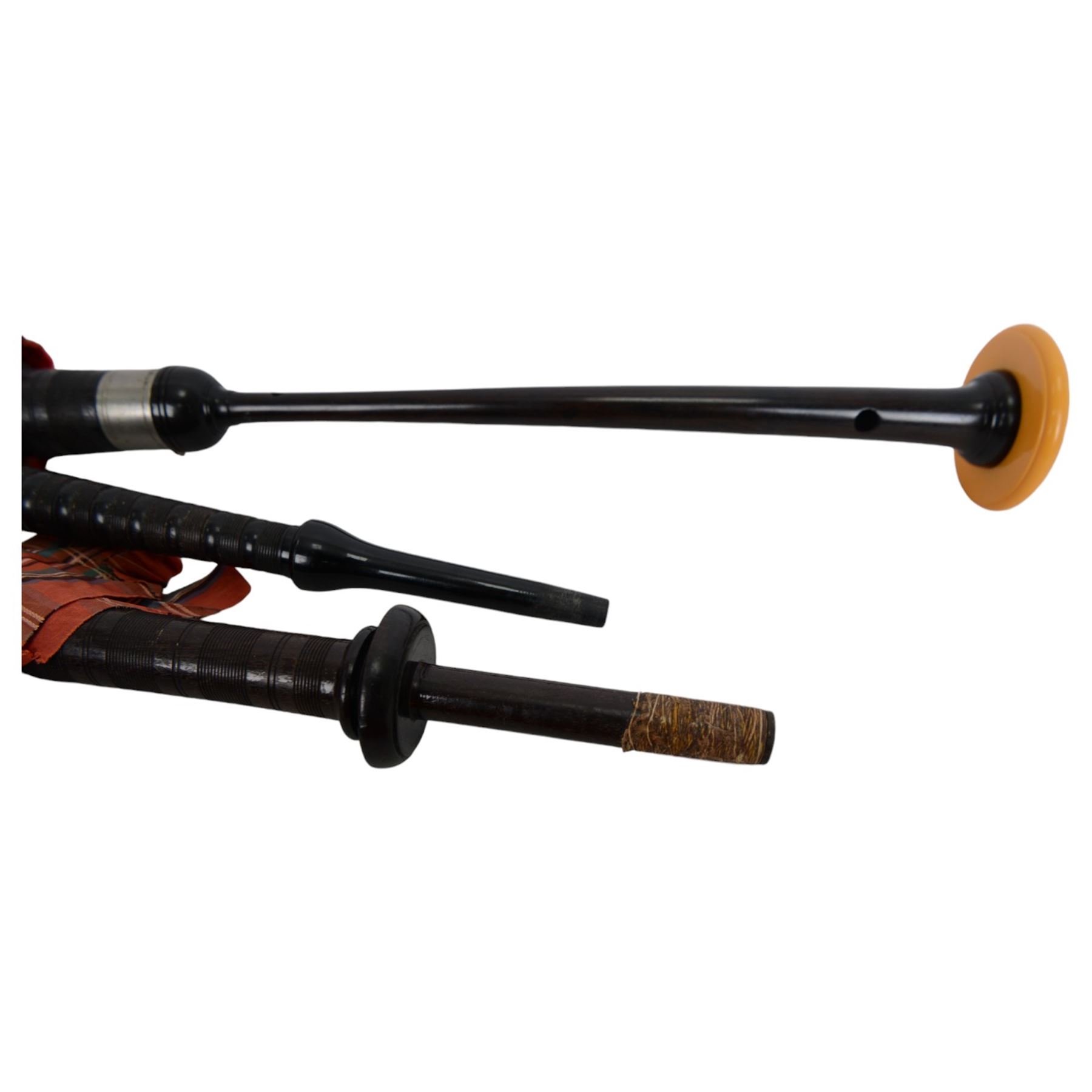 Set of mid 20th century bagpipes, with McLeod chanter, Royal Stuart cover, tassels, ribbons and spare accessories, contained within a wooden carry case, together with a Scarborough Highland Pipe Band uniform, comprising black highland dress jacket, Royal Stuart kilt, Glen Garry hat, Swinging Six sporren, Sgian Dubh knife, piper's dirk with knife and fork, etc