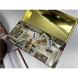 Postcards including WW1 silk postcards, local interest and photographic postcards, gas mask in box, material tape measure and metal sign. 