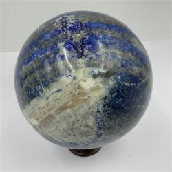 Lapis lazuli sphere upon a carved wooden base 