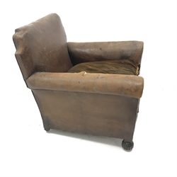 Early 20th century Howard style armchair upholstered in a dark tan leather with melon fluted supports, W87cm