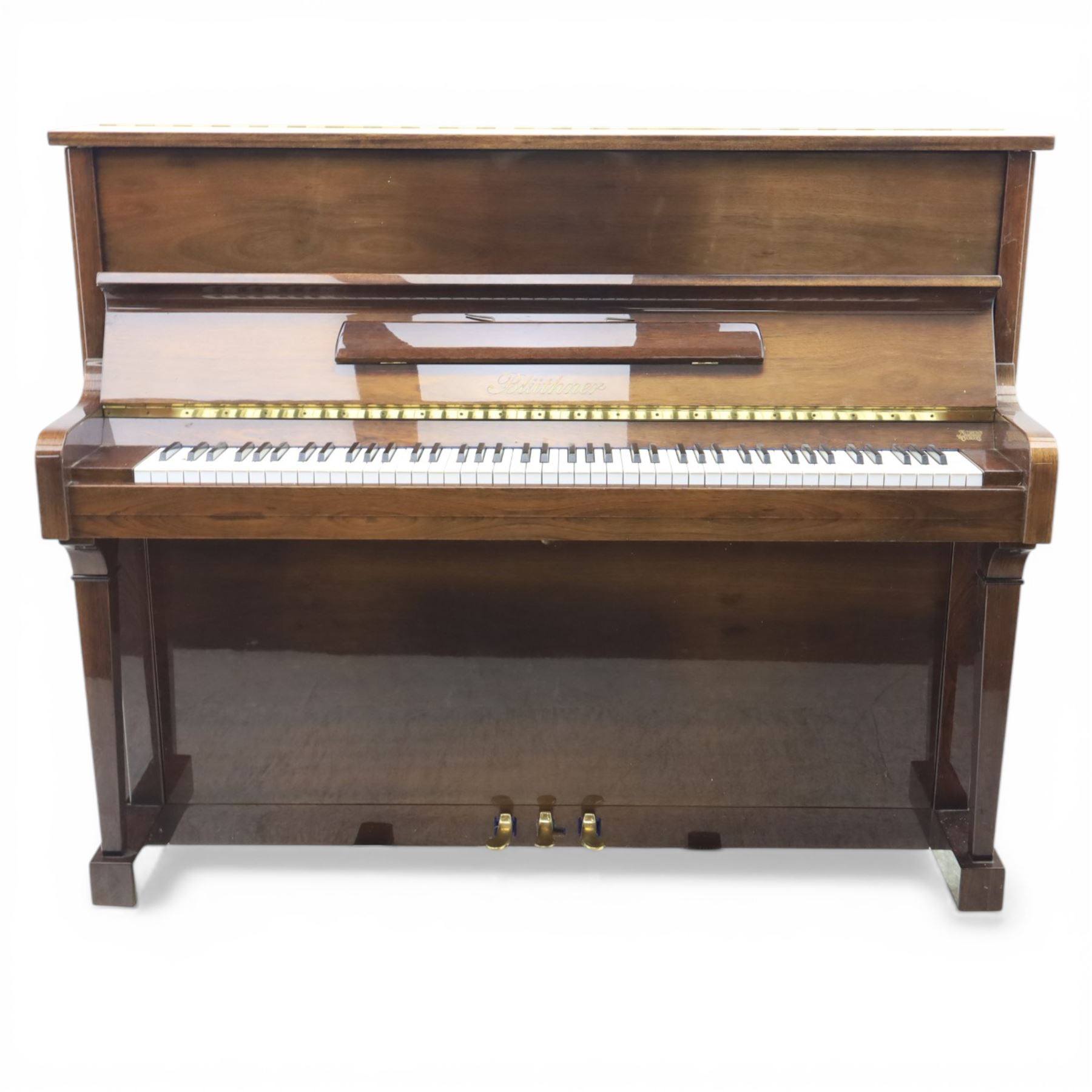 Bluthner of Leipzig upright piano, mahogany case with 88 keys and three brass pedals