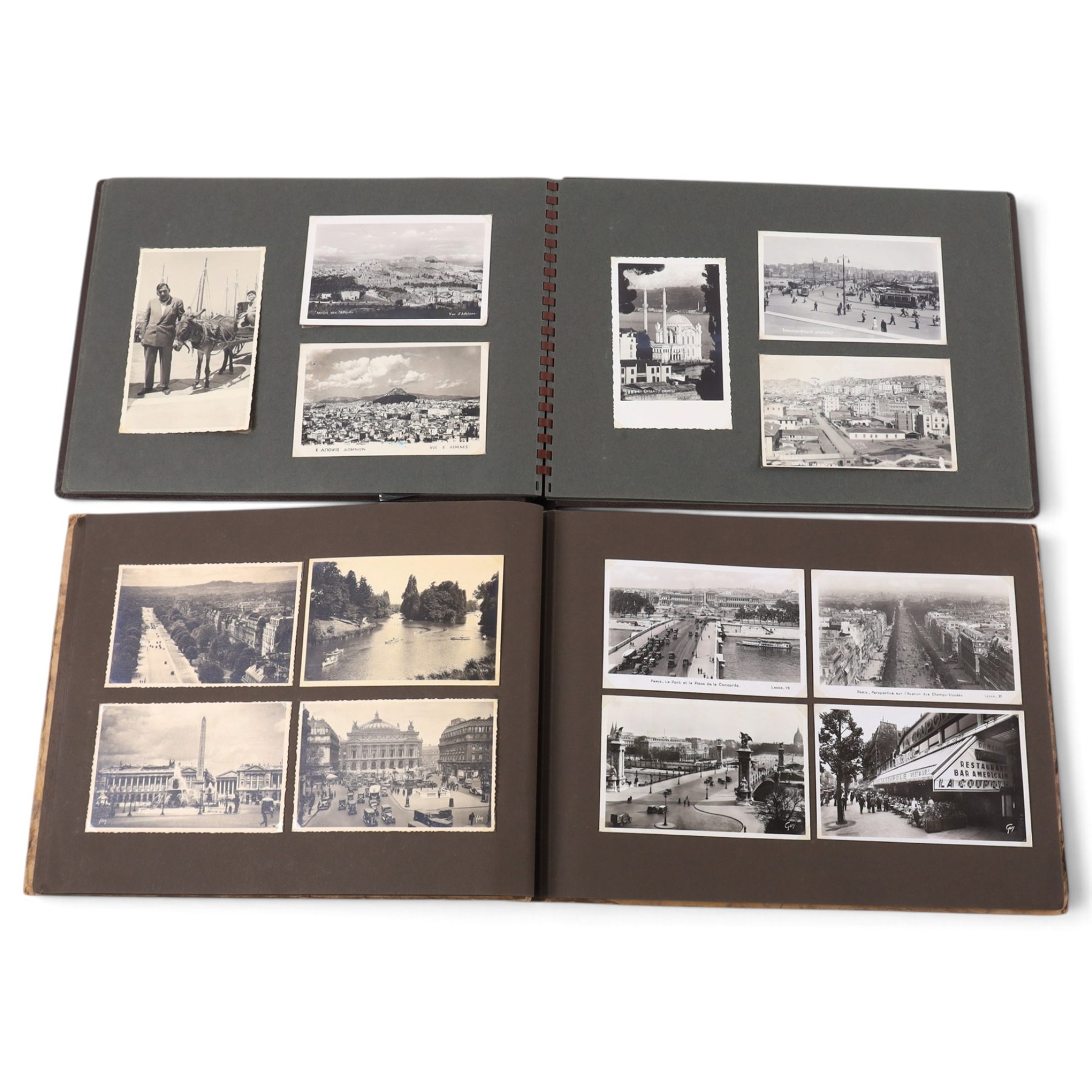 Two early to mid 20th century postcard albums, containing black and white and colour postcards of France, Turkey and Egypt, together with some personal photographs and newspaper clippings