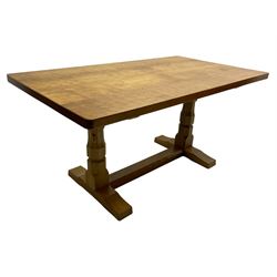 Mouseman - oak dining table, adzed rectangular top on twin octagonal pillar supports, sled...
