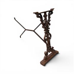Pair of Victorian cast iron table end supports, of pierced and scrolling foliate design with central masks, united by X-form stretcher, with later top