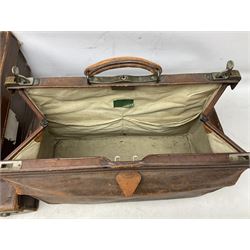 Early 20th century tan leather Gladstone bag, bearing initials GAH to one side, together with a similar smaller example and four vintage tan leather suitcases, two with impressed initials, largest including handle H37cm (6)
