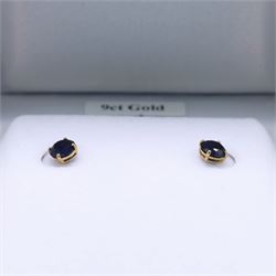 Pair of 9ct gold blue stone stud earrings, boxed