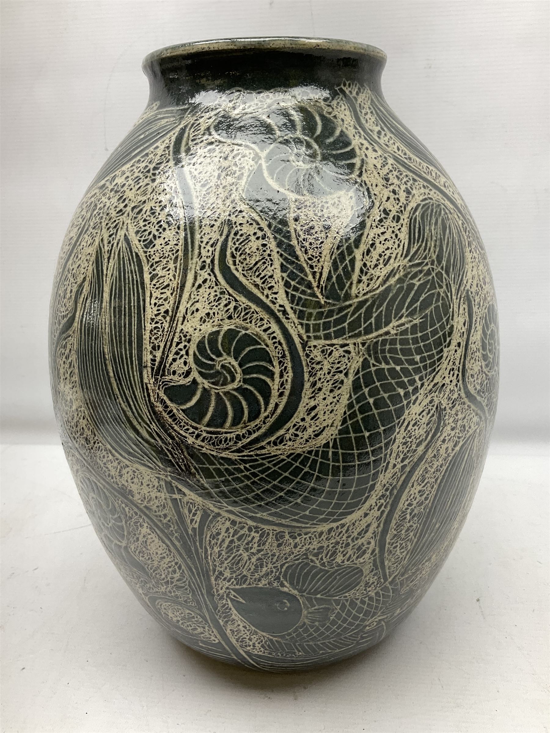 John Egerton (c1945-): studio pottery stoneware vase decorated with fish, mermaids and ammonites, H38cm