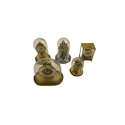 A  late 20th century German Kieninger & Obergfell, “Kundo” battery operated 
mantle clock under an acrylic shade, with four German anniversary torsion clocks
