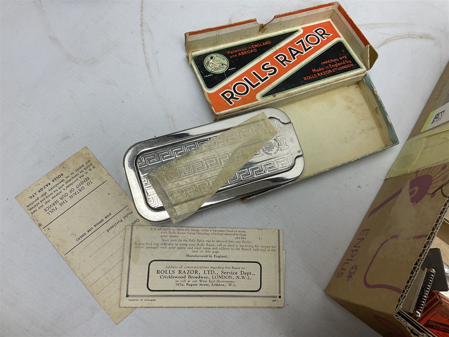 Collection of various razors and smoking items to include Ronson brass table lighter, Rolls Razor, Seigneur case with lighter, etc