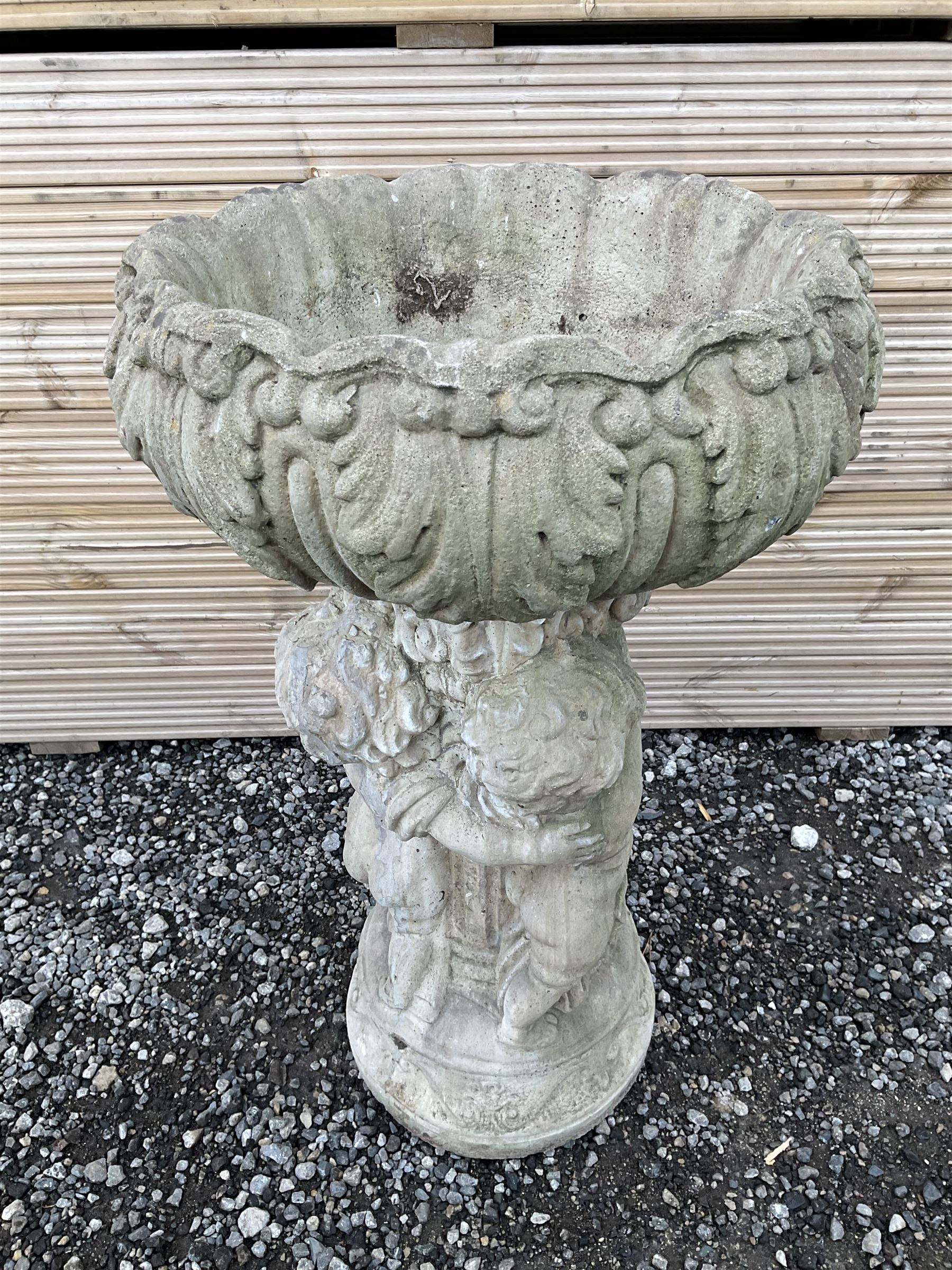 Cast stone planter or bird bath, supported by classical putti on circular base - THIS LOT IS TO BE COLLECTED BY APPOINTMENT FROM DUGGLEBY STORAGE, GREAT HILL, EASTFIELD, SCARBOROUGH, YO11 3TX