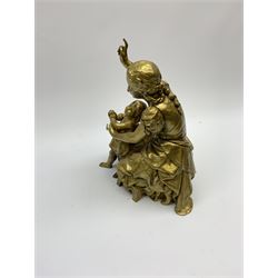 A gilt bronze figure of a mother and child, with signature, H22cm. 