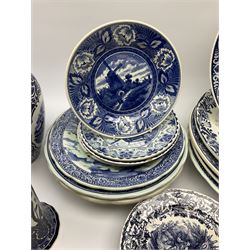 A large collection of modern transfer printed Delft ware, to include large baluster vase, H42cm, two jars and covers, largest H40cm, pair of tapering cylindrical vases, H31cm, and a number of plates of various size and design. 