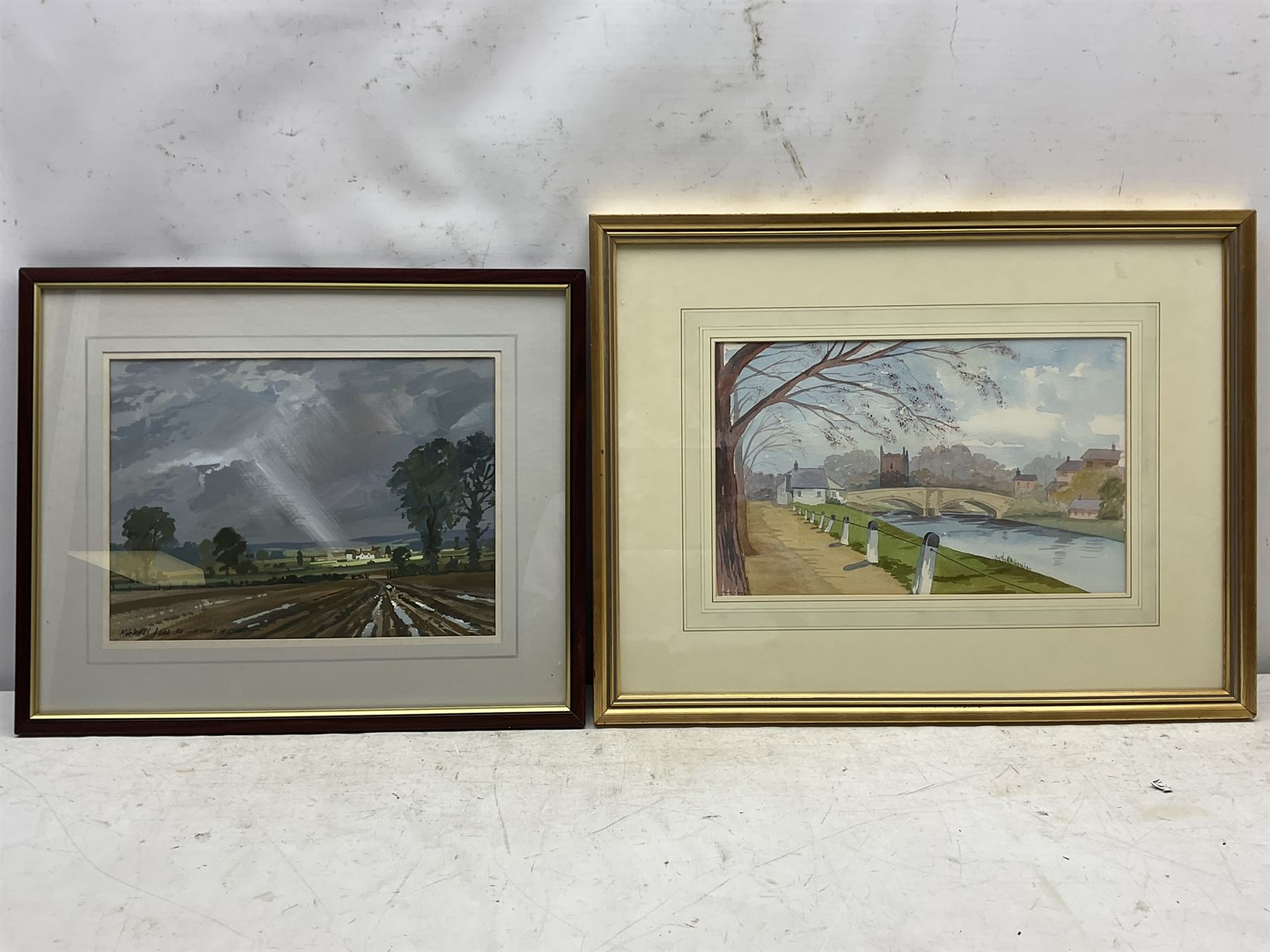 Michael Long (Bristol Savages 1940-): 'A Shaft of Light', gouache signed titled and dated '90, 25cm x 34cm; James Robson (Harrogate 20th century): Village Bridge, watercolour signed, artist's address label verso 23cm x 36cm; Roy Wrench (Bristol Savages): 'Newton Ferrers - Devon', watercolour signed and titled 29cm x 38cm; Charles James Kelsey (British 1870-1960): 'Hard Work', oil on board, signed and titled verso 22cm x 32cm (4)
