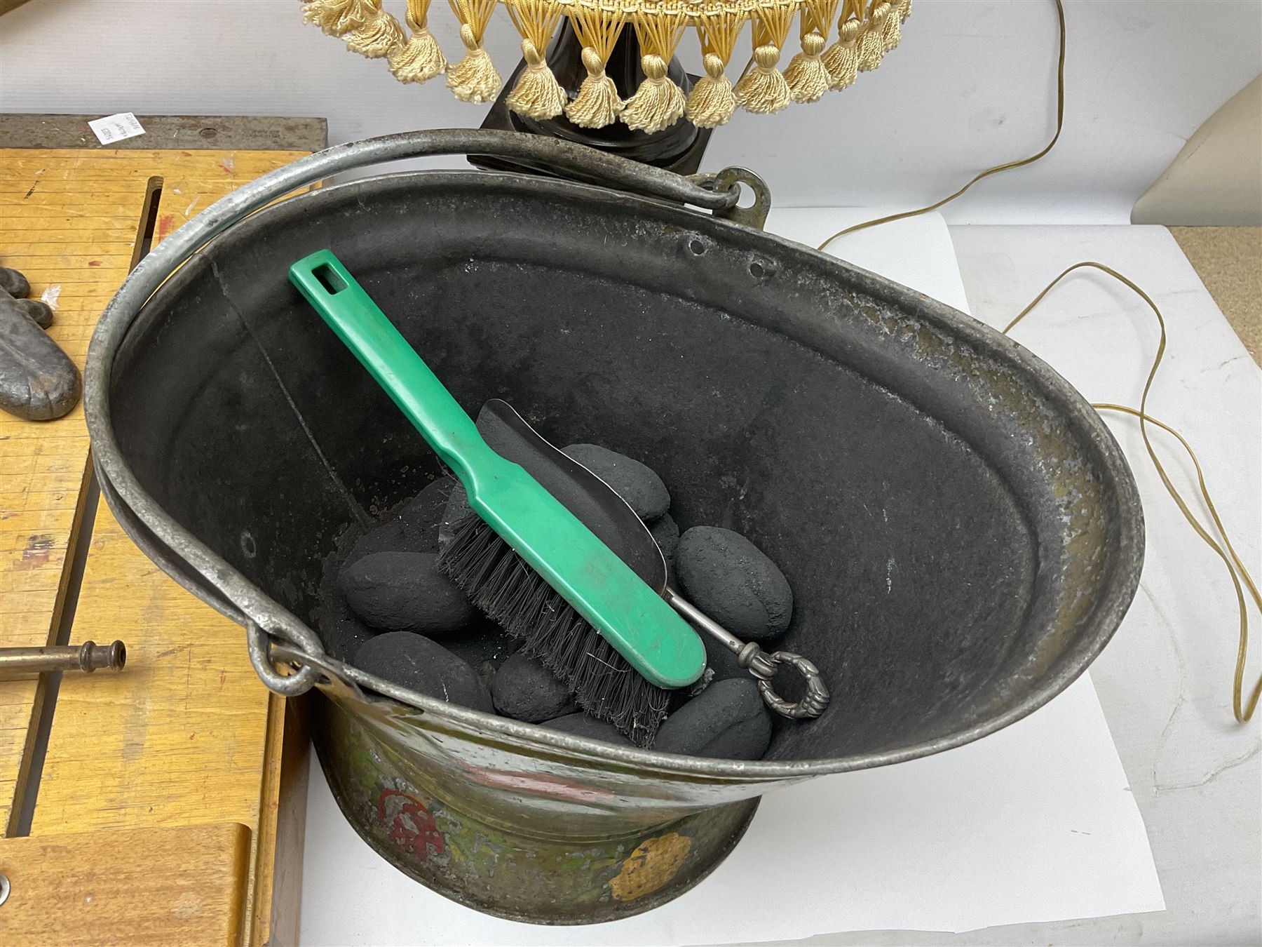 Coal bucket painted with flowers together with pair of bellows, boot scraper in the form of a beetle, wooden guillotine, composite table lamp with tassel lampshade and one other