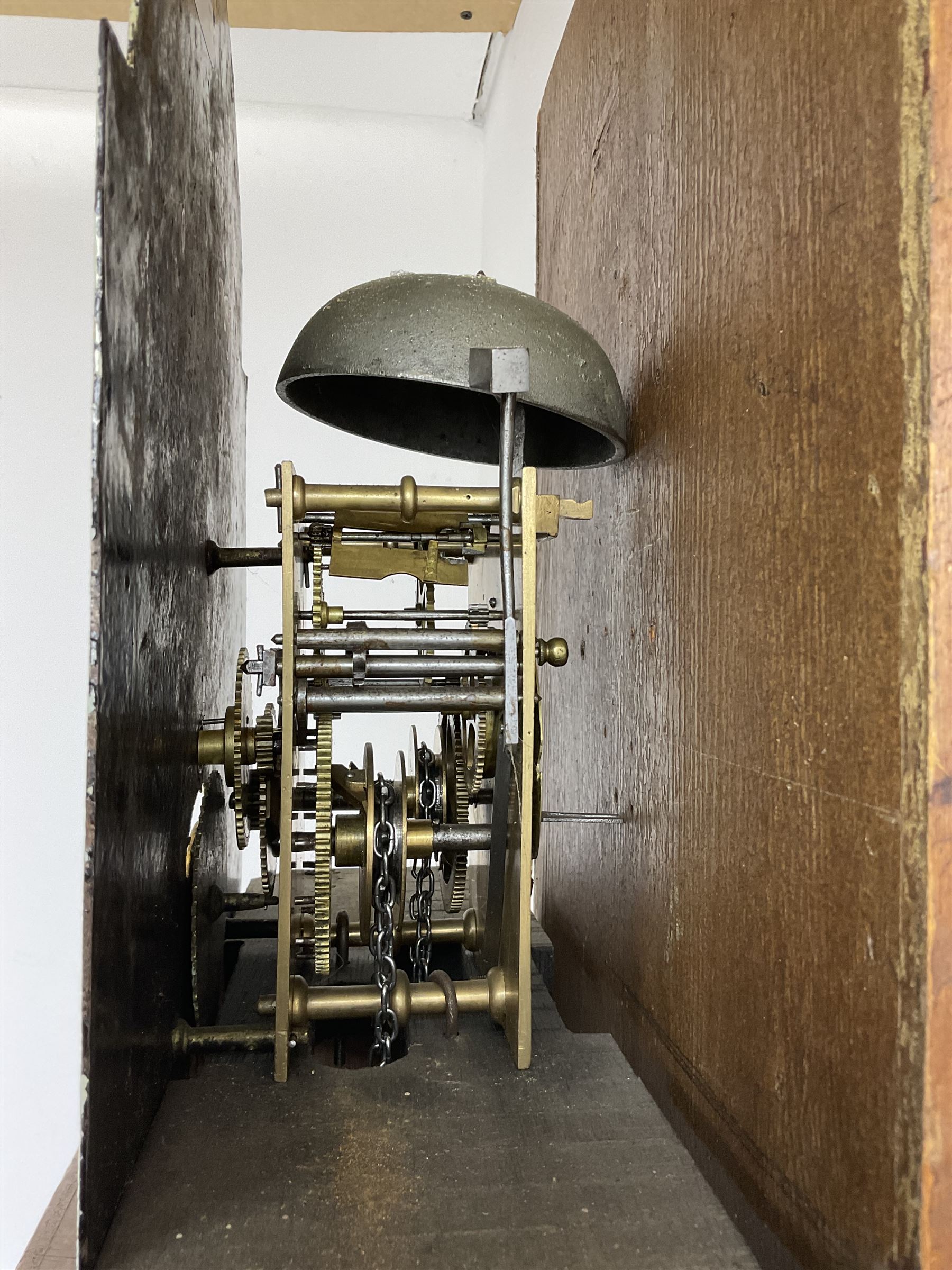 Thomas Wrangles -  early 19th-century oak longcase clock with a swans neck pendulum and three brass finials, glazed hood door flanked by two free standing pilasters, long trunk door with a break-arch top on a square plinth raised on bracket feet, painted dial inscribed T Wrangles Scarboro, dial pinned directly to a 30-hour chain driven count wheel movement striking the hours on a bell.
 With pendulum and weight. 