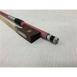 Zest full size pink violin, with a solid wood body and maple head, with matching pink bow and two further bows, in a hard case Length 60cm