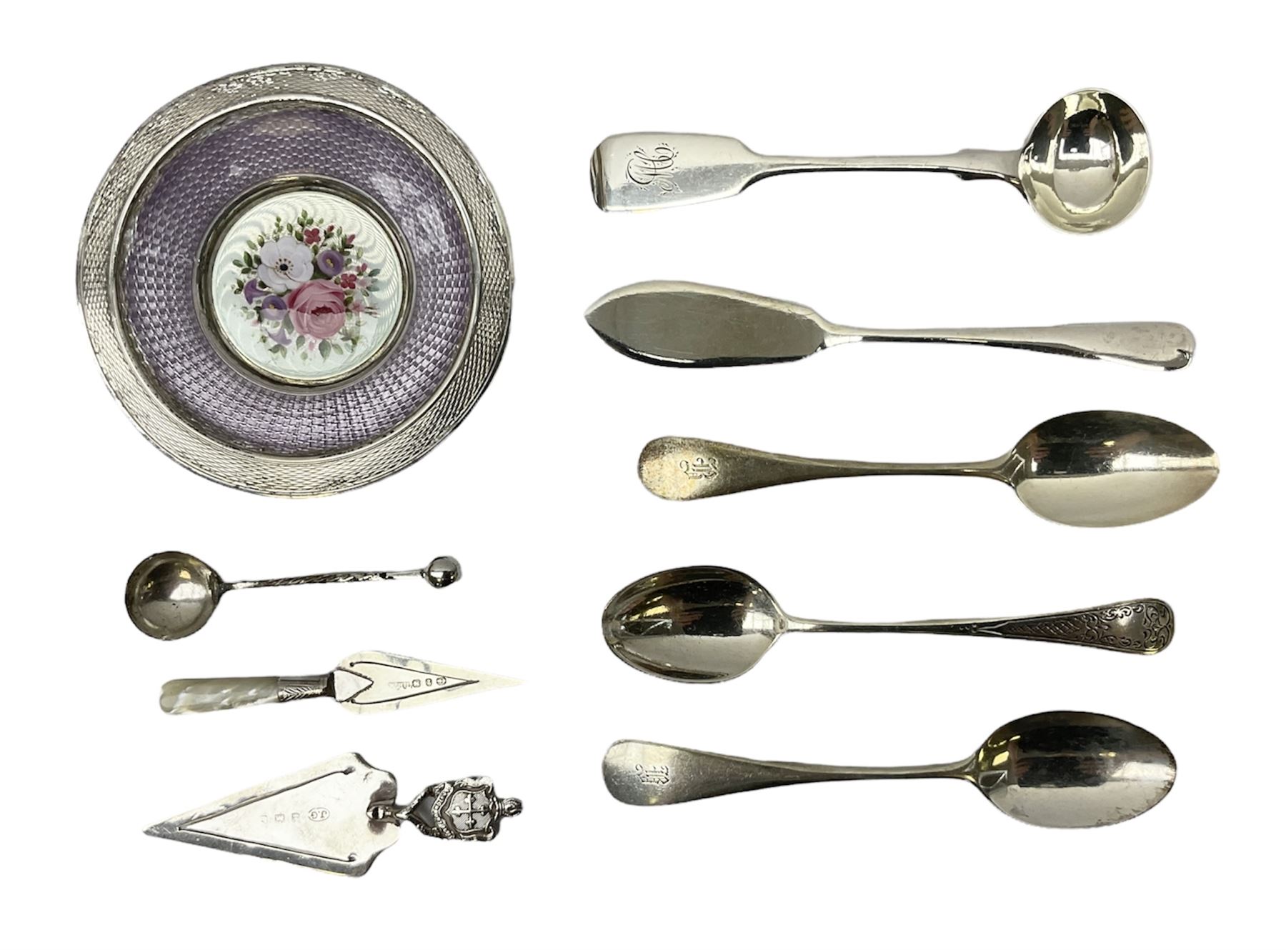 Two small silver page markers in the form of trowels, both hallmarked, together with a small silver and enamel dish, decorated with central panel of flowers, with London import mark, and a small group of flatware, to include Victorian salt spoon, approximate gross weight 111.6 grams