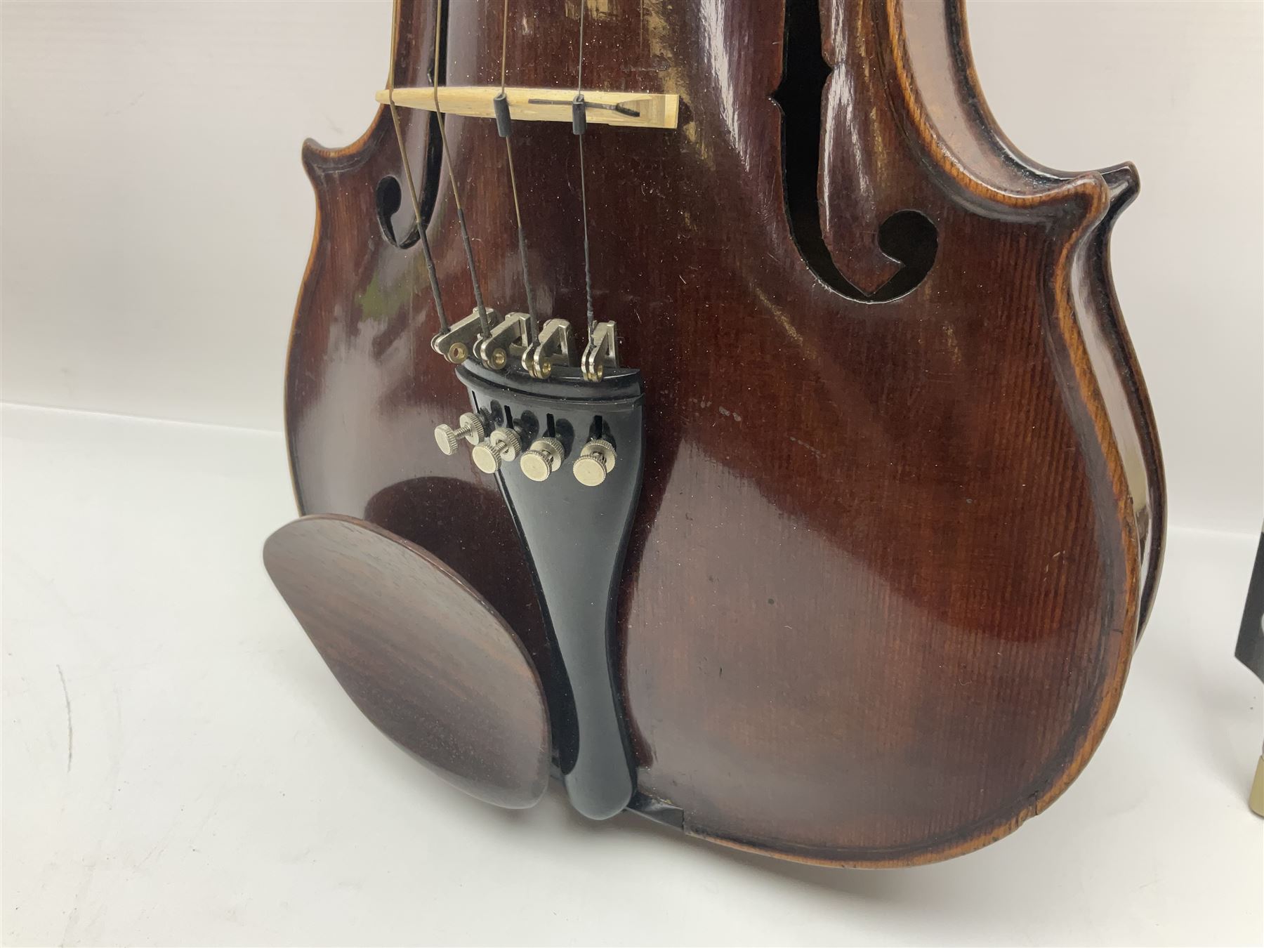 German trade violin in the Steiner style c1900 with 35.5cm two-piece maple back and ribs and spruce top L59cm overall; in fitted carrying case with two bows; and a Saxony violin with 35.5cm one-piece maple back and ribs and spruce top L58.5cm overall (2)
