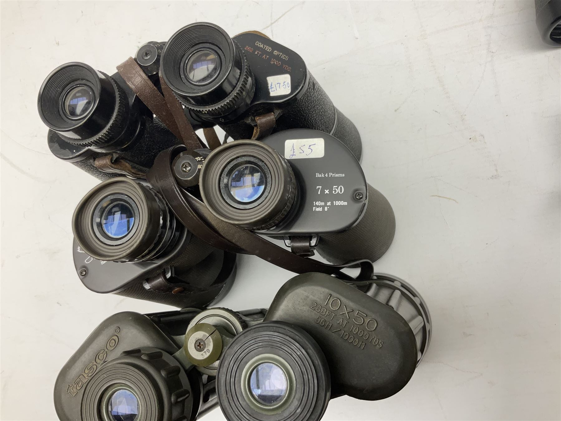 Eleven pairs of binoculars to include Lieberman & Gortz 20x65, Stem (USSR) 7x50, Helios 10x50 Field, Prinz 12x50, Tasco 8x40, Tasco 10x50, etc