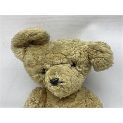 1950s sheepskin plush covered teddy bear with musical movement, the revolving head with applied eyes, leather nose and stitched mouth, jointed limbs with leather pads H50cm