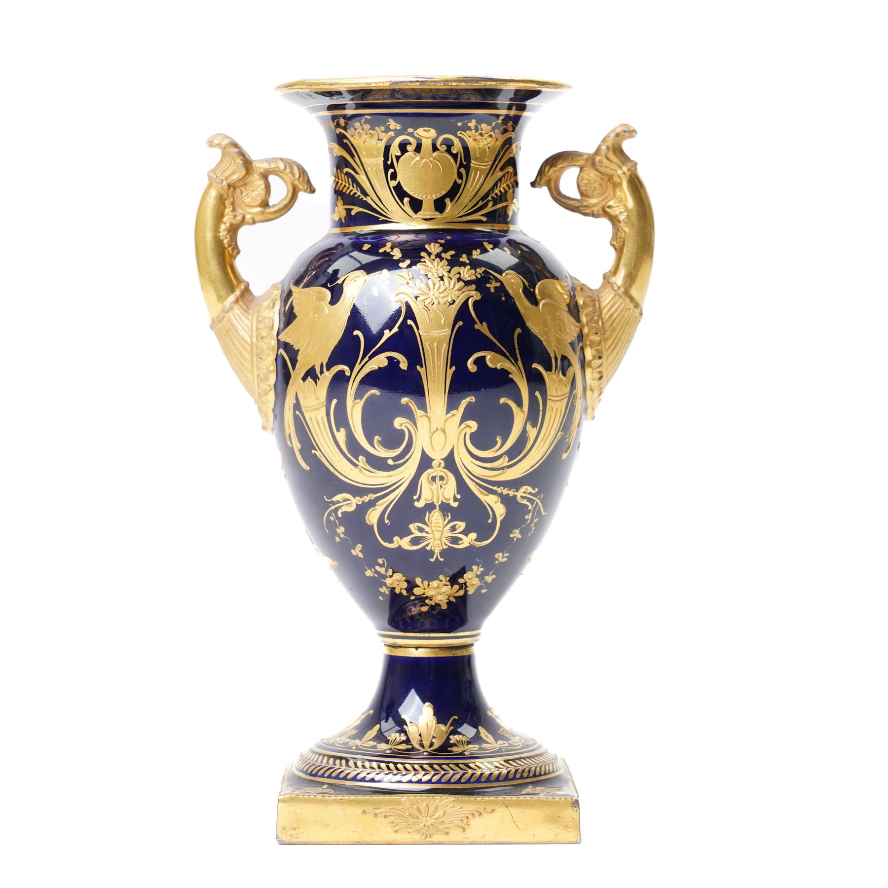 19th century Berlin porcelain urn, with twin gilt volute handles, painted with a portrait bust on cobalt blue ground and decorated profusely in gilt with classical motifs, indistinctly signed, with blue sceptre mark to base, H15cm