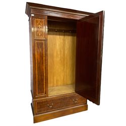 Edwardian inlaid mahogany wardrobe, projecting cornice with chequered frieze over single door with rectangular mirror plate, flanked by panels to each side inlaid with satinwood stringing and flower motif, the base fitted with single drawer