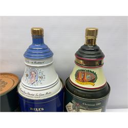 Bells, Scotch whisky, in seven Wade ceramic decanters, including Christmas 1988, 1989, 1990, 1991 etc